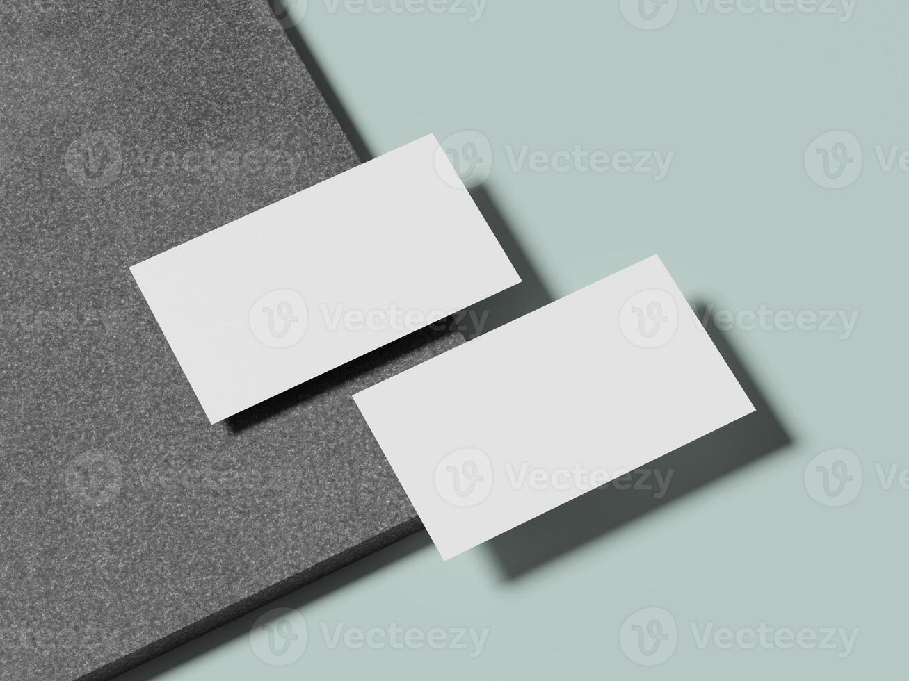 White business cards resting on a smooth marble surface, giving a fresh and minimalist look. photo