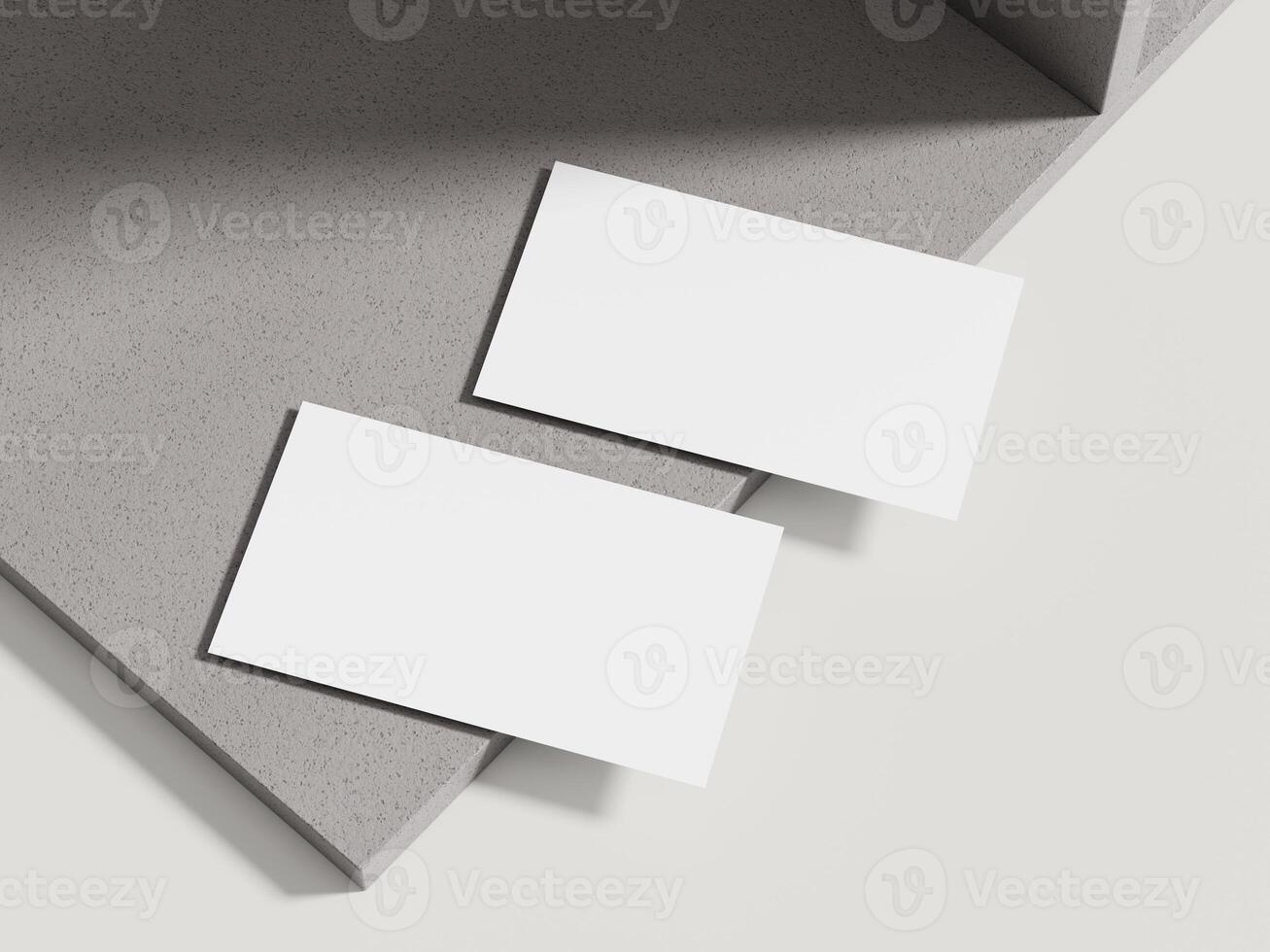 A sophisticated business card mockup placed on a beige cement block with subtle shadows, perfect for luxury branding. photo
