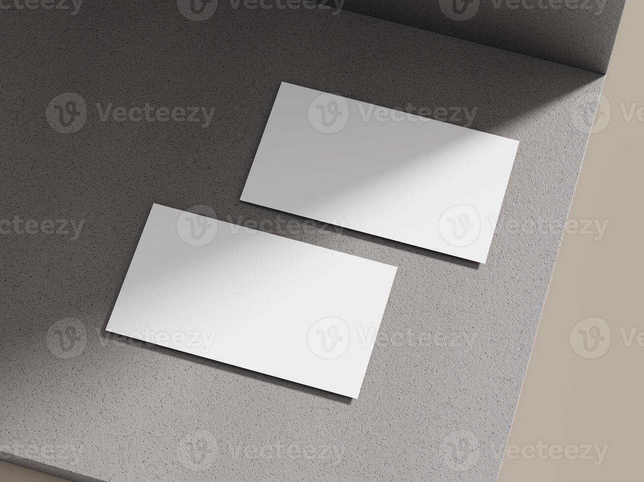 Business card mockup lying on a soft cement block surface with natural light, creating a relaxed and professional look. photo