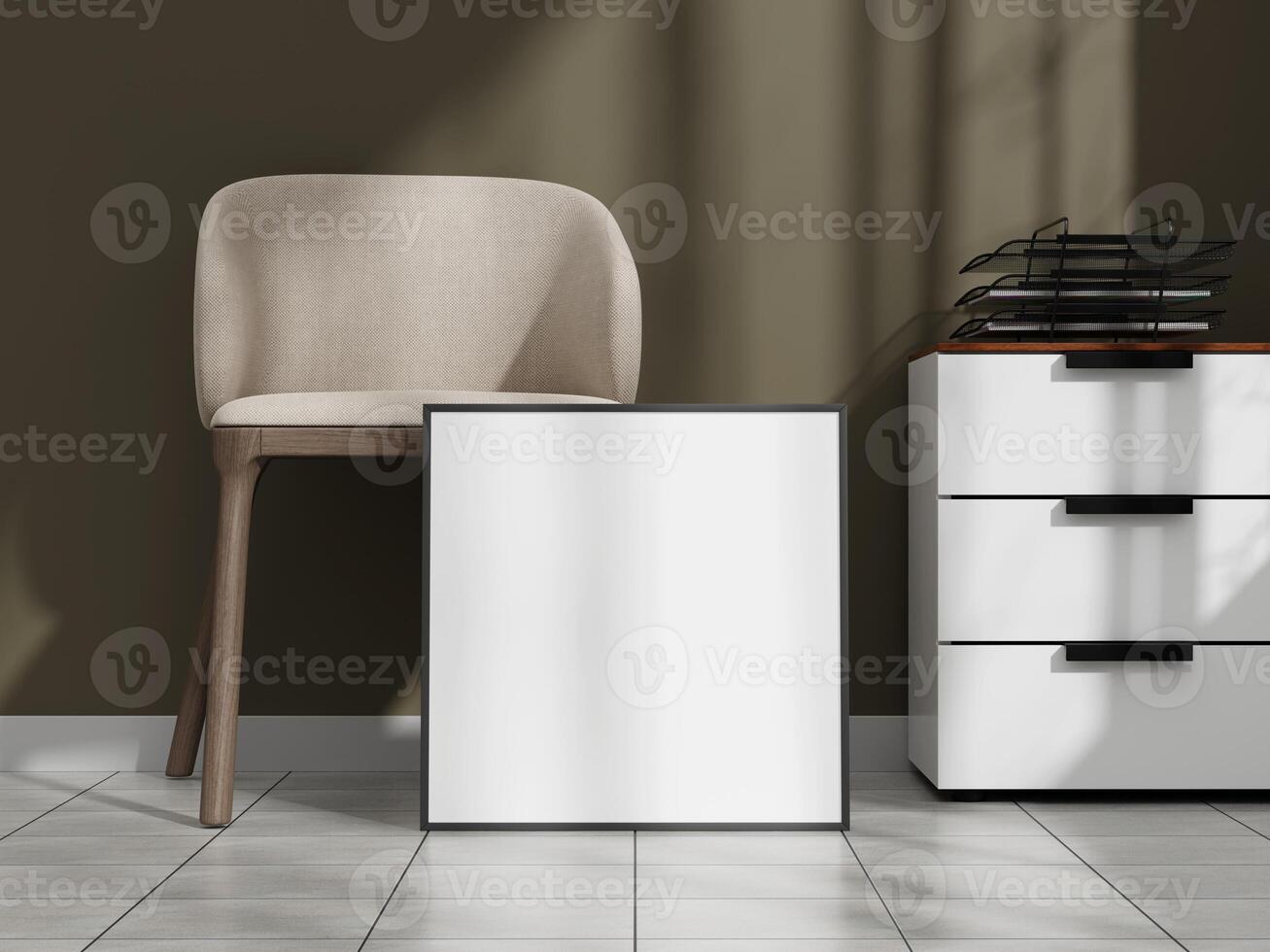 White poster frame mockup on the floor in a modern interior with a beige chair and a drawer unit, illuminated by natural light. photo