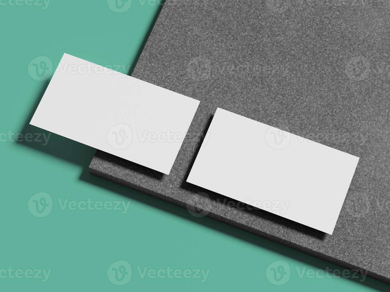 Two pristine white business cards arranged on a polished marble surface, offering a timeless and sleek appearance. photo