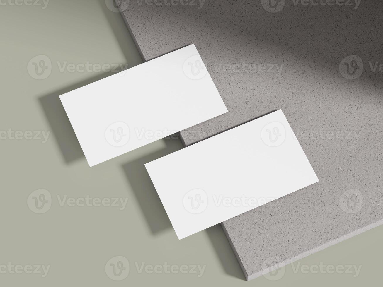 A business card mockup leaning on a muted grey cement block with soft lighting, ideal for luxury brand displays. photo