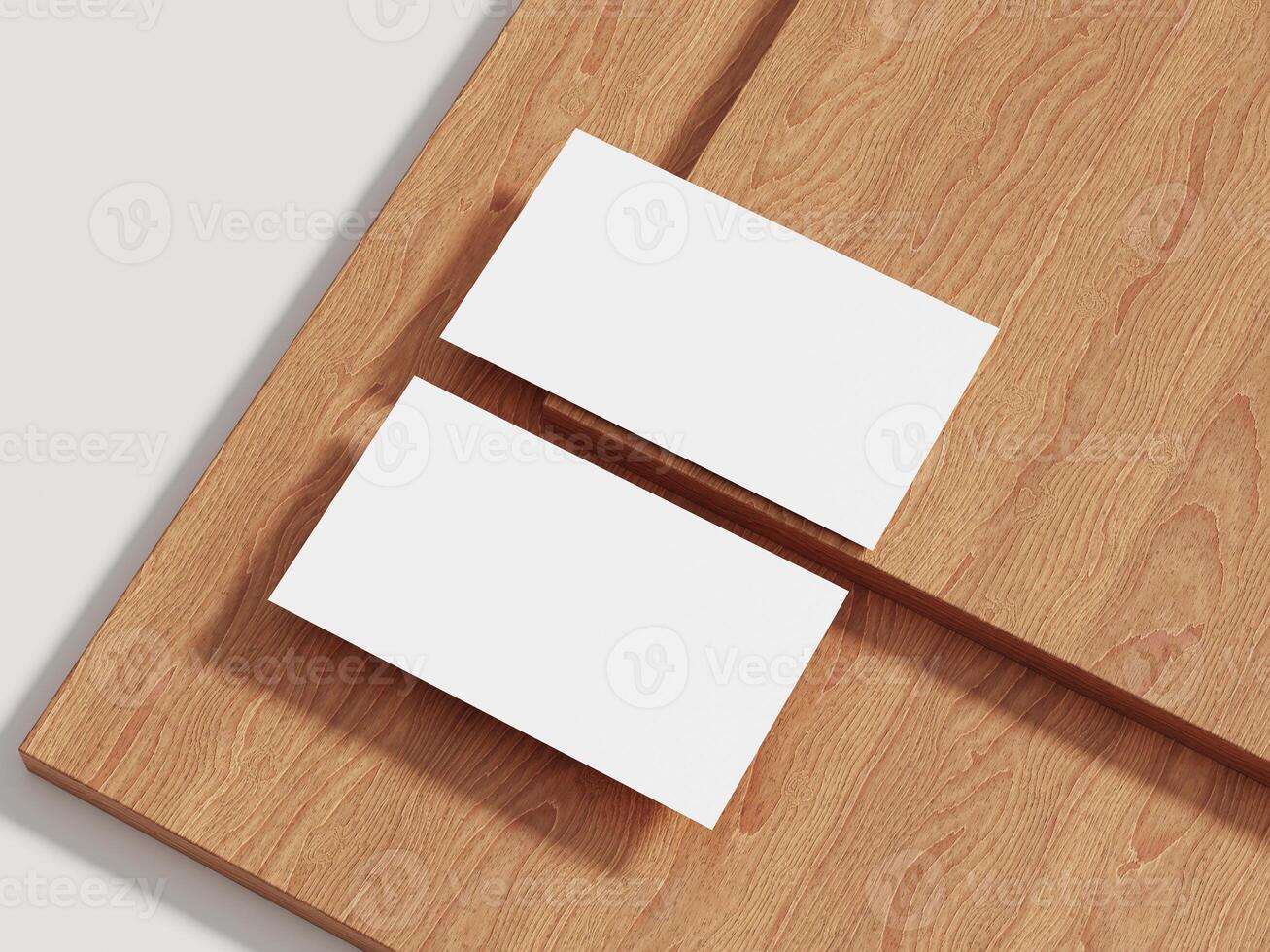 Business card mockup resting on a wooden surface with subtle shadows, ideal for minimalistic branding presentations. photo