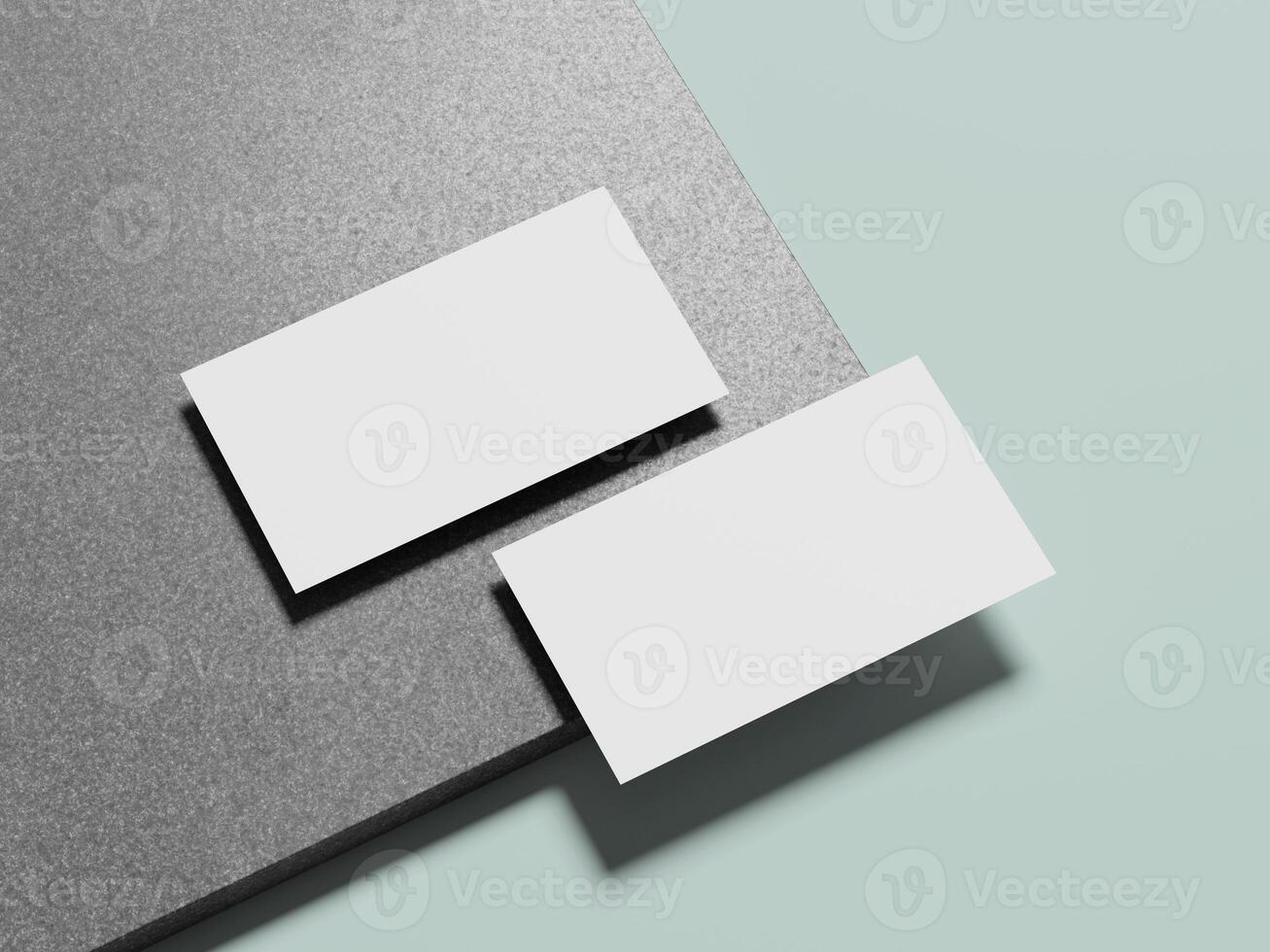 Simple white business cards laid on a refined marble background, showcasing an understated, sophisticated design. photo