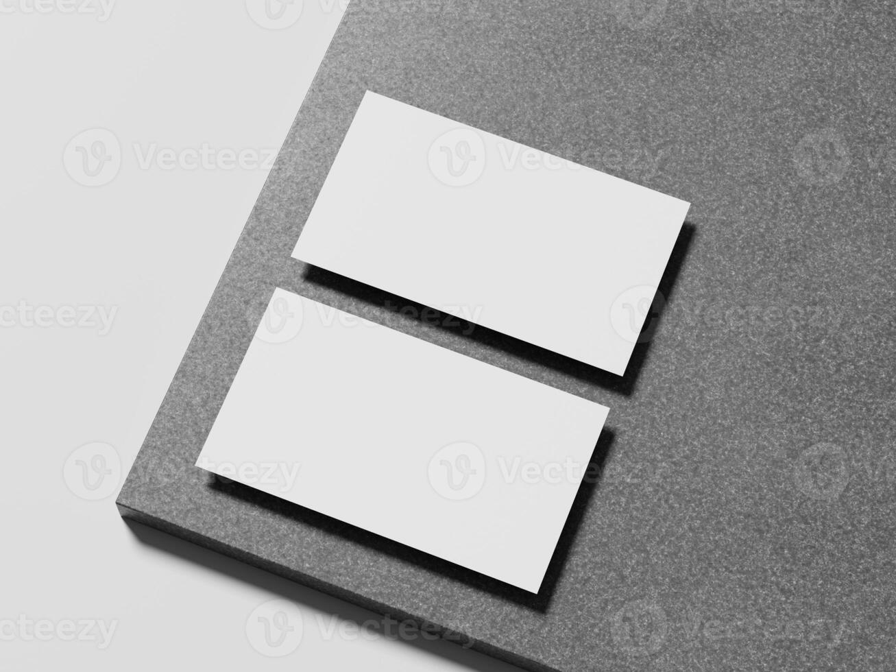 Elegant white business card placed on a sleek marble surface, with a soft shadow enhancing its modern design. photo