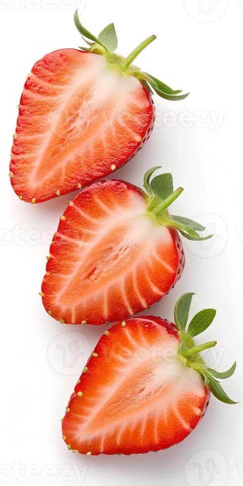 Freshly Sliced Strawberries on a White Surface photo