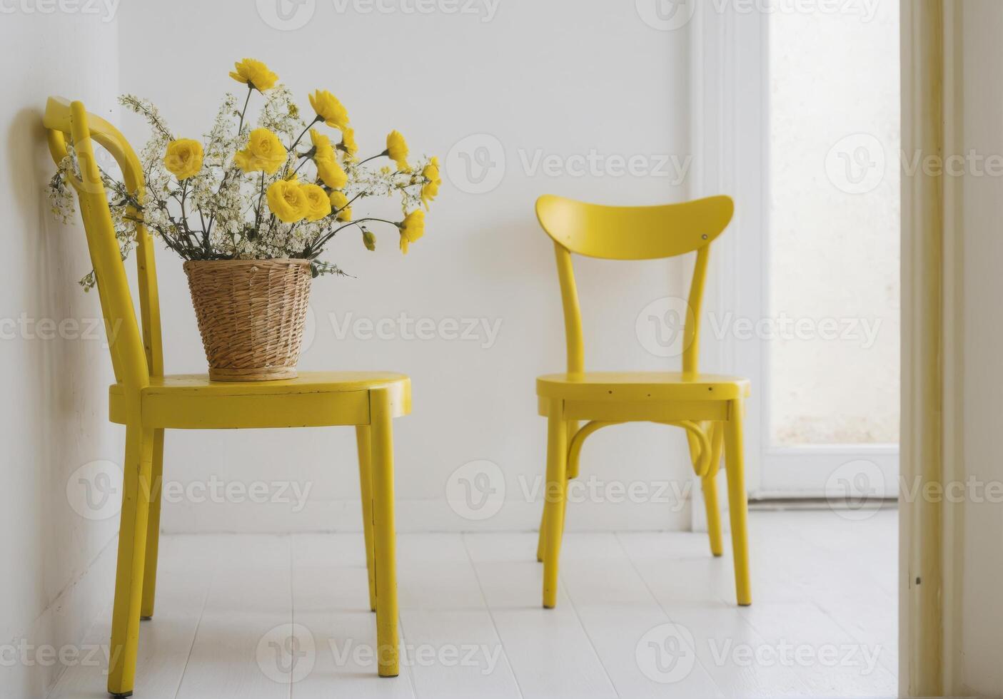 Two yellow chairs are placed next to each other in a room with a white wall photo