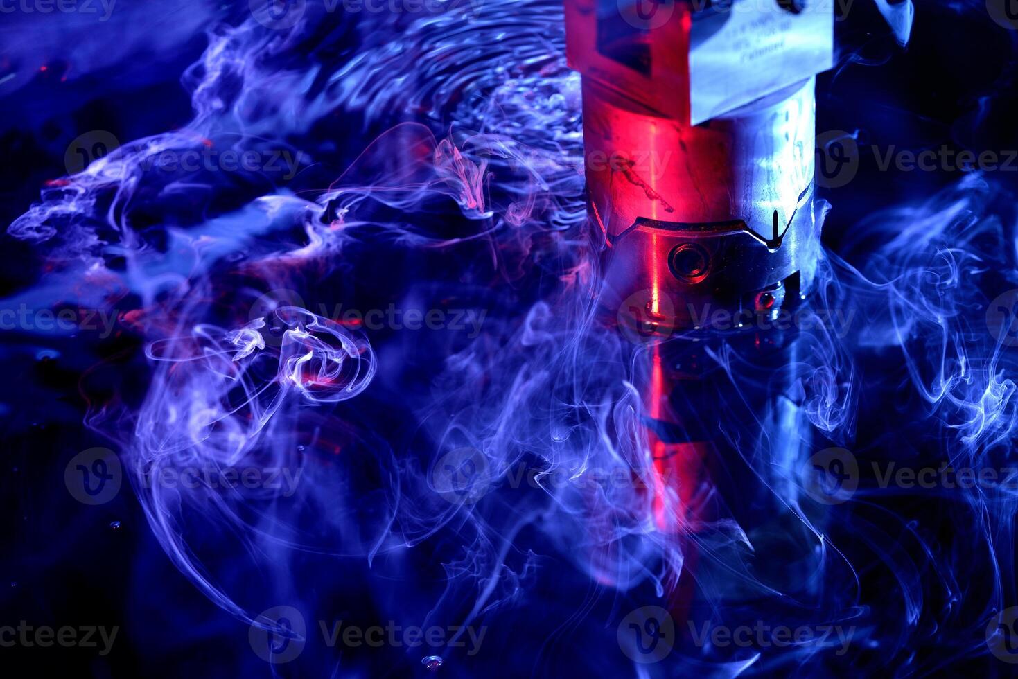 machine working on liquid with blue illumination photo