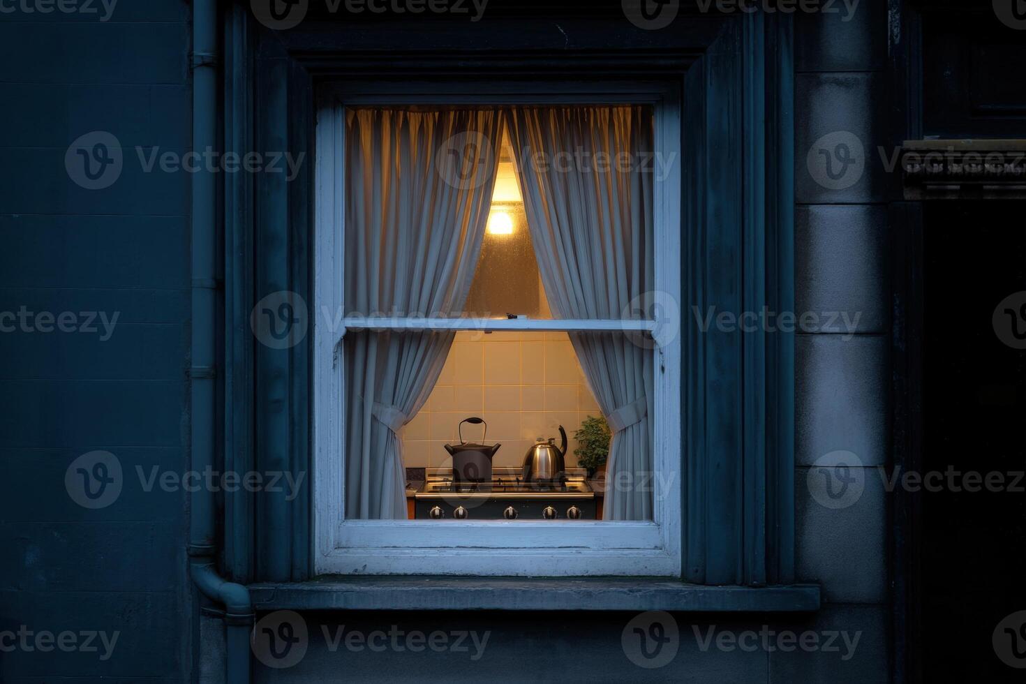 Cozy kitchen illuminated at night in a residential building photo