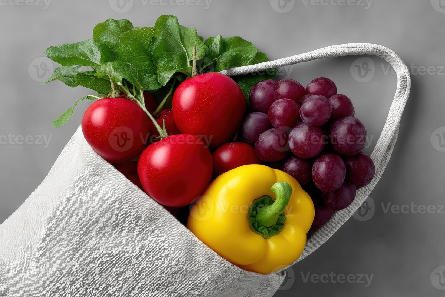 Fresh vegetables and fruits in a reusable bag ready for a healthy meal preparation photo