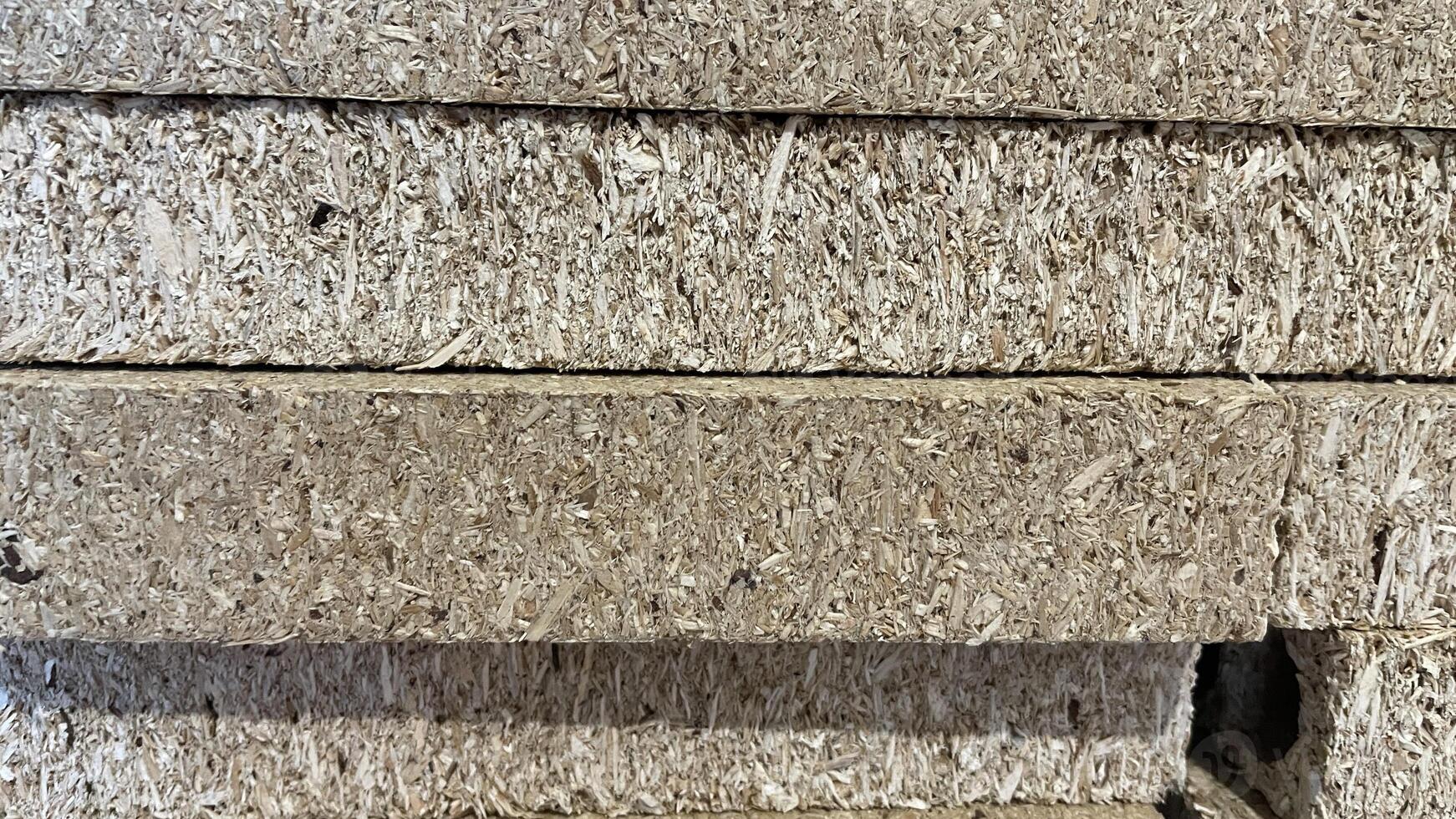 Wood-based panels stacked for processing in a manufacturing facility photo