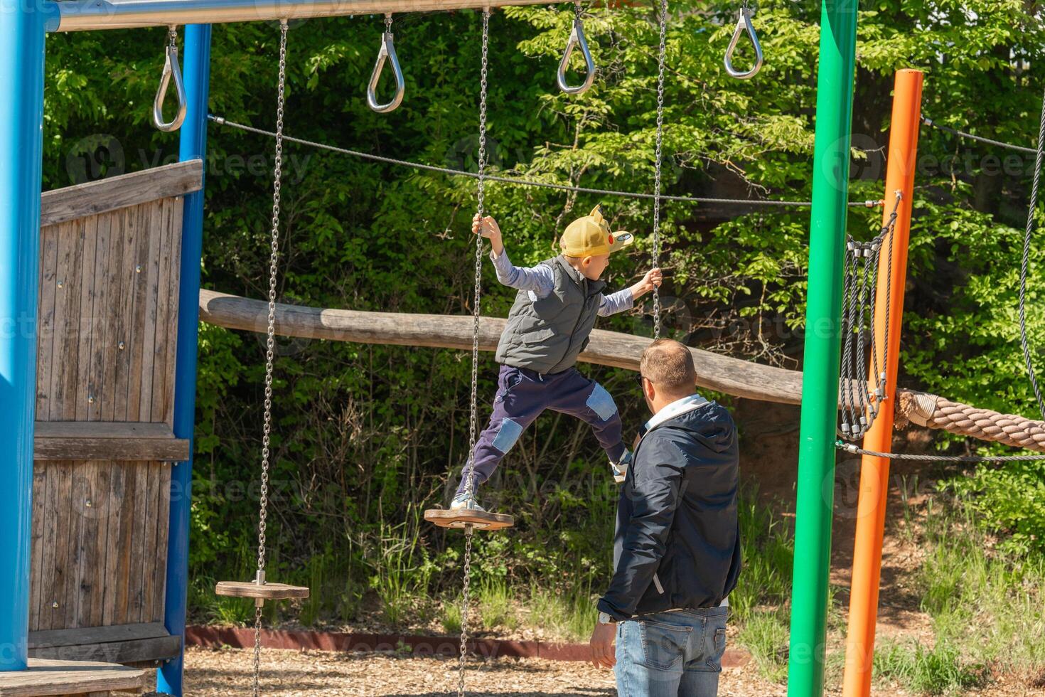 Child Balancing on Adventure Playground Equipment photo