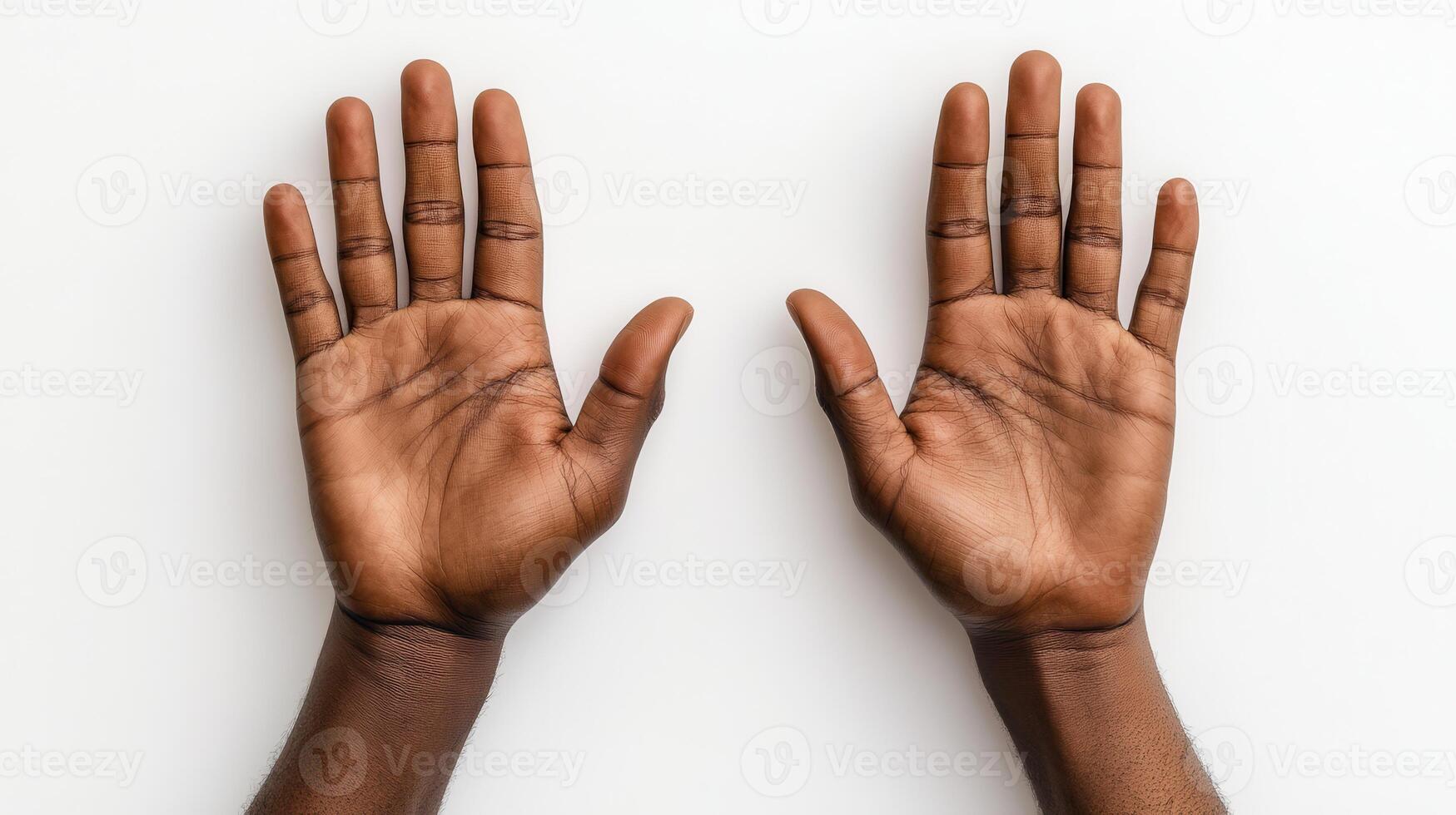 Two open hands displaying palm gestures against a neutral background showcase expression and communication photo