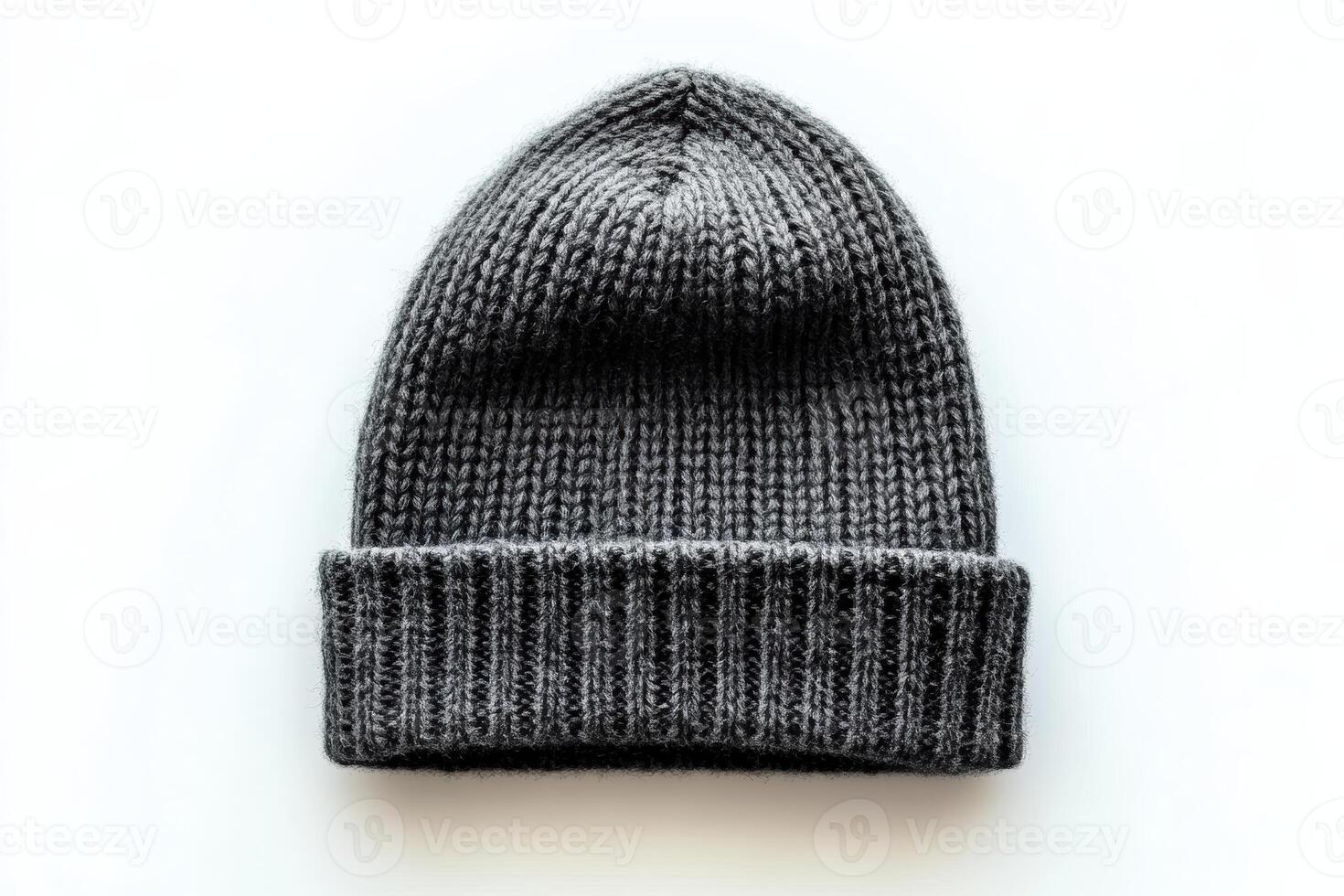 Warm knitted beanie resting on a light background for winter fashion enthusiasts photo