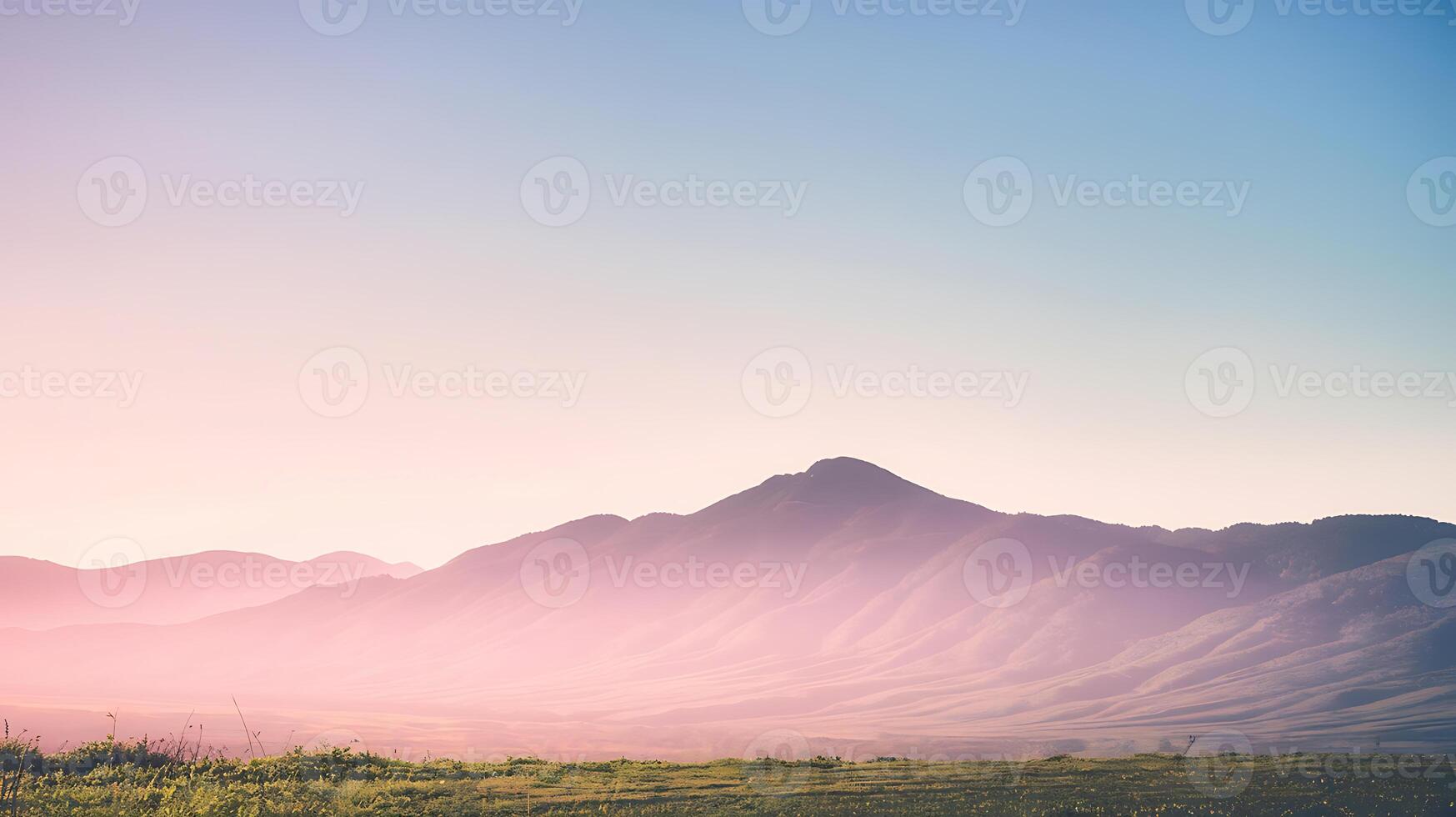 A mountain range with a sunset in the background photo