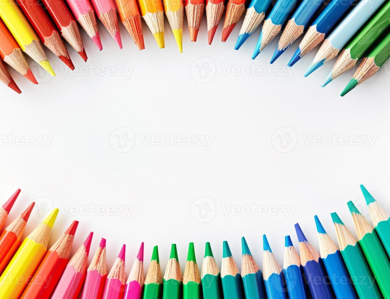 A row of colourful pencils are arranged in a circle isolated on a white background photo