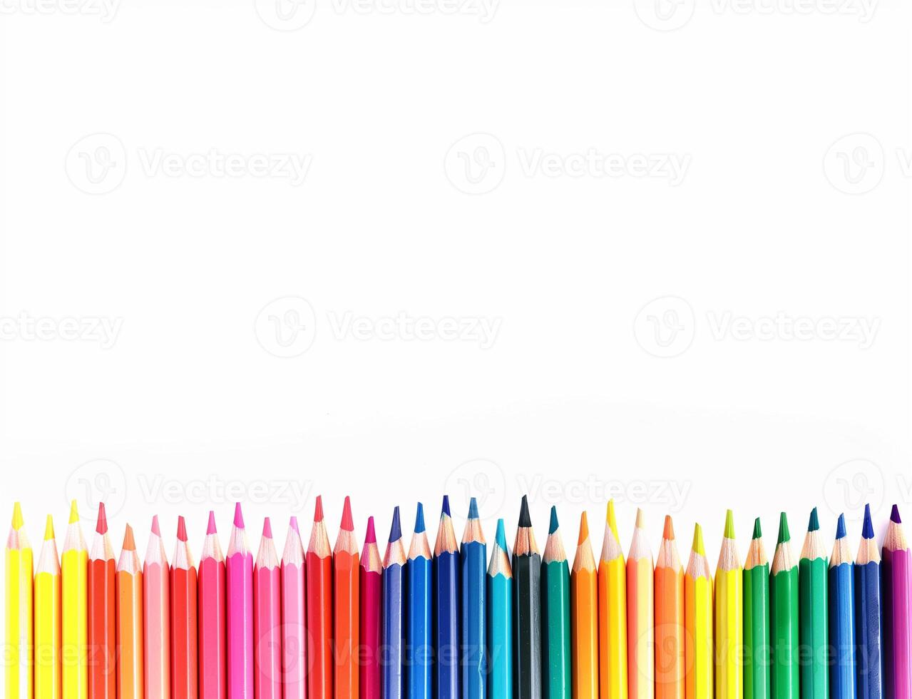 A row of colourful rainbow pencils on a white background photo