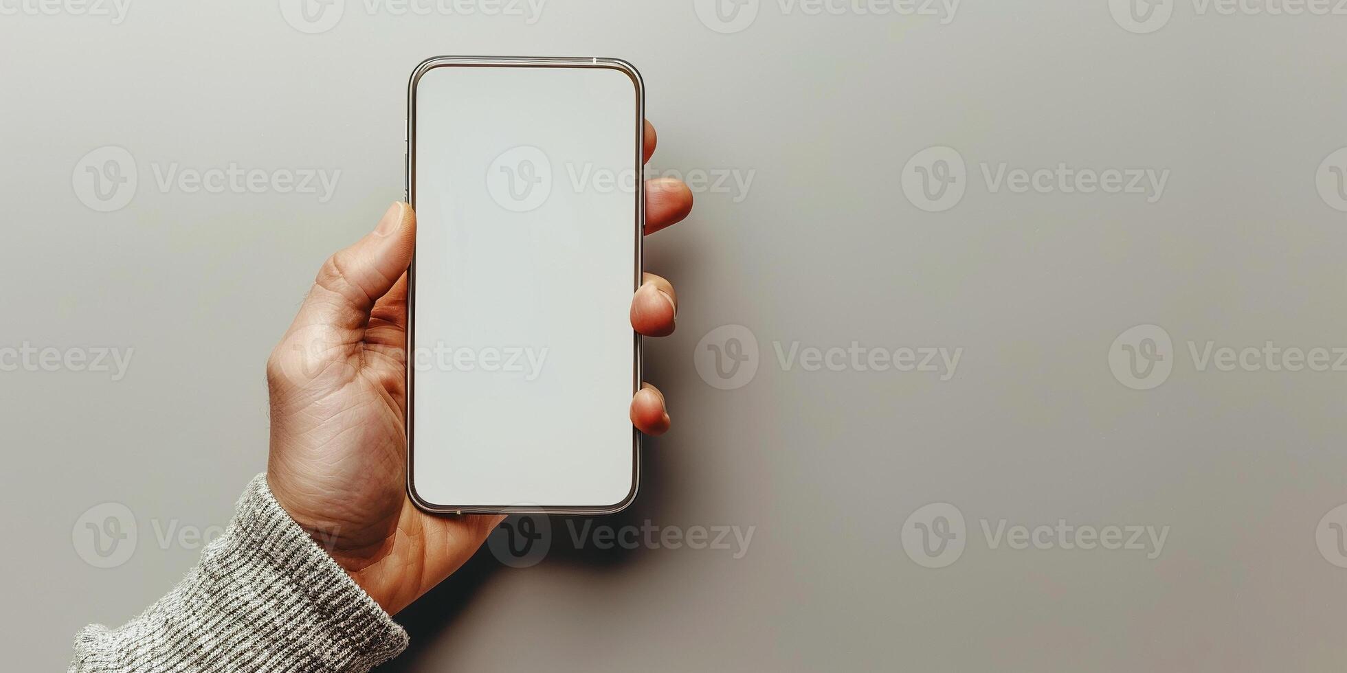 A person is holding a cell phone with a white screen photo