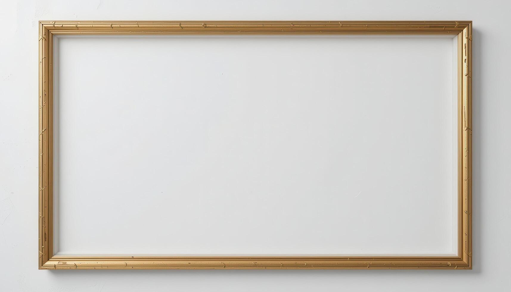 Empty gold picture frame against a plain background. photo