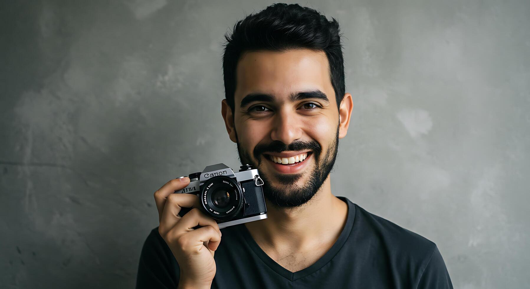 A man with a beard and a camera photo