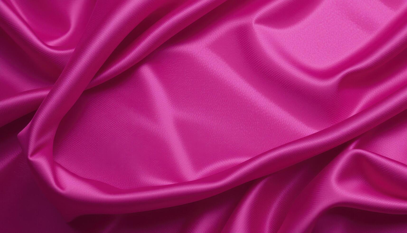 Close-up view of vibrant fuchsia draped fabric. photo