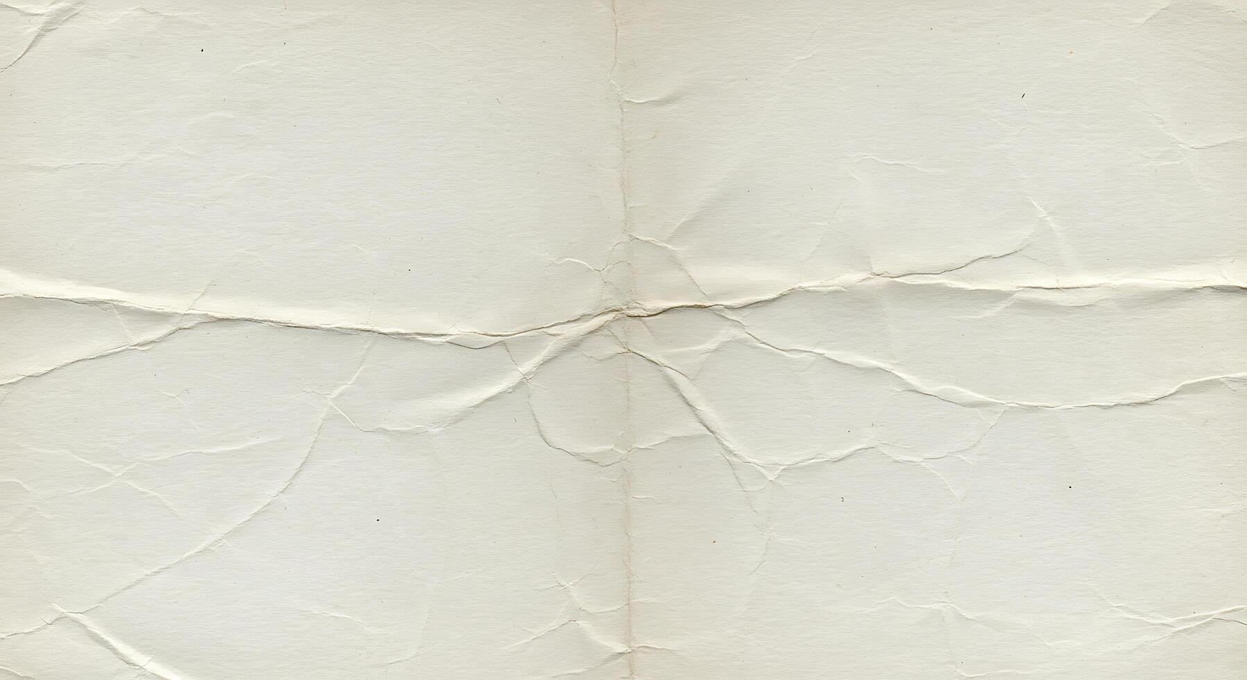 An old white paper with a crease in it photo