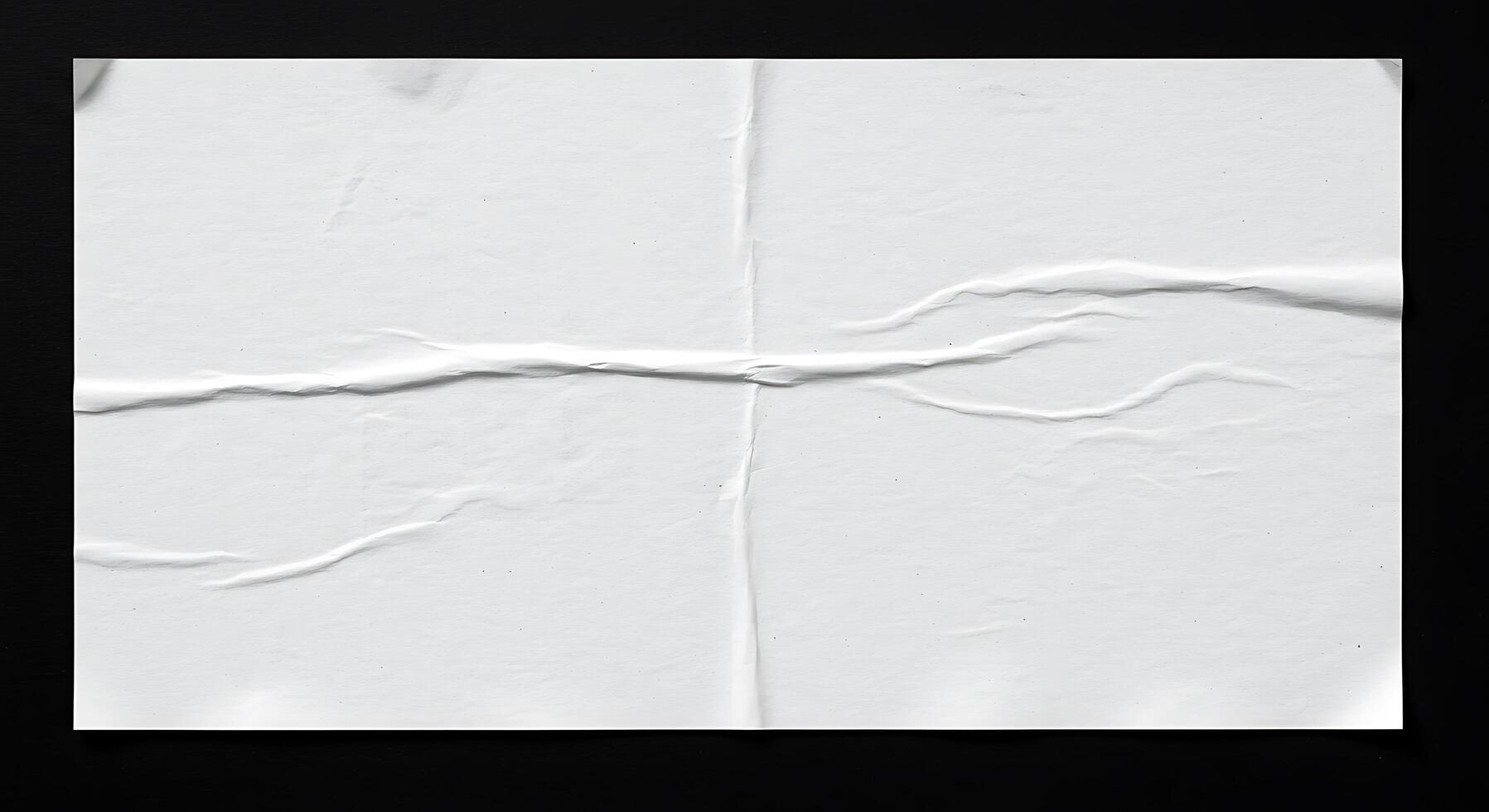 A piece of white paper with a crack in it photo