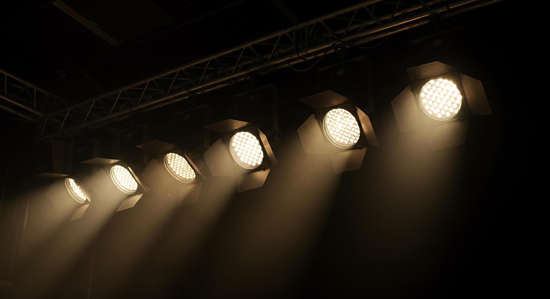 Spotlights on stage in a dark room photo