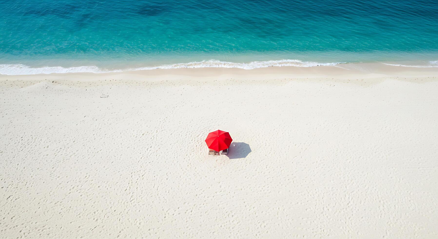 A red umbrella on a beach photo