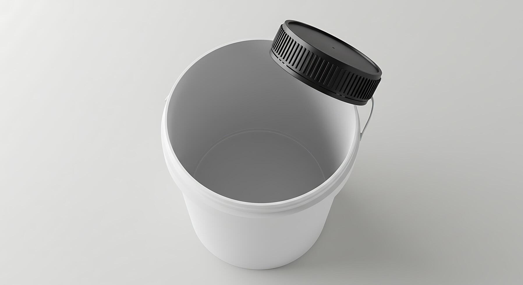 A white container with a black lid photo