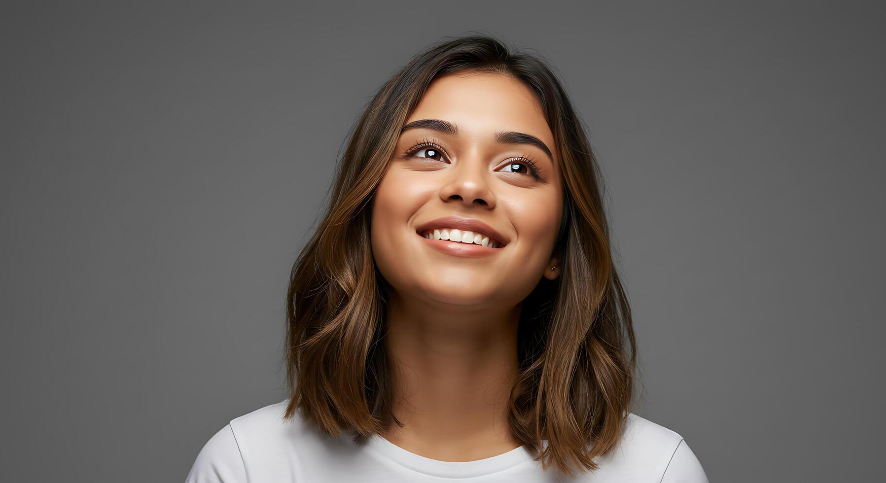 A woman smiling with her eyes closed photo