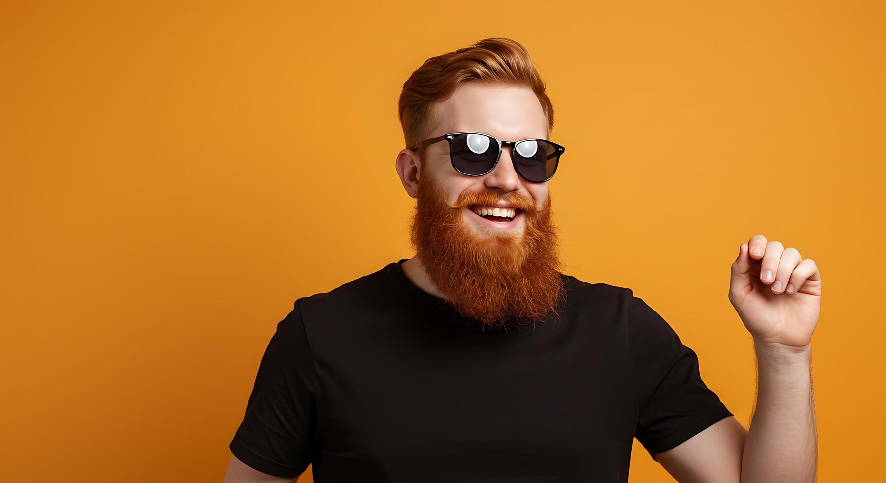 A man with a red beard and sunglasses is smiling photo
