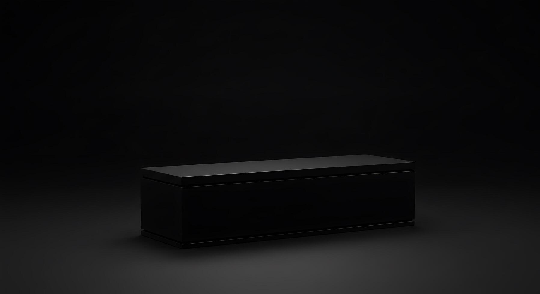 A black box sitting on a dark surface photo