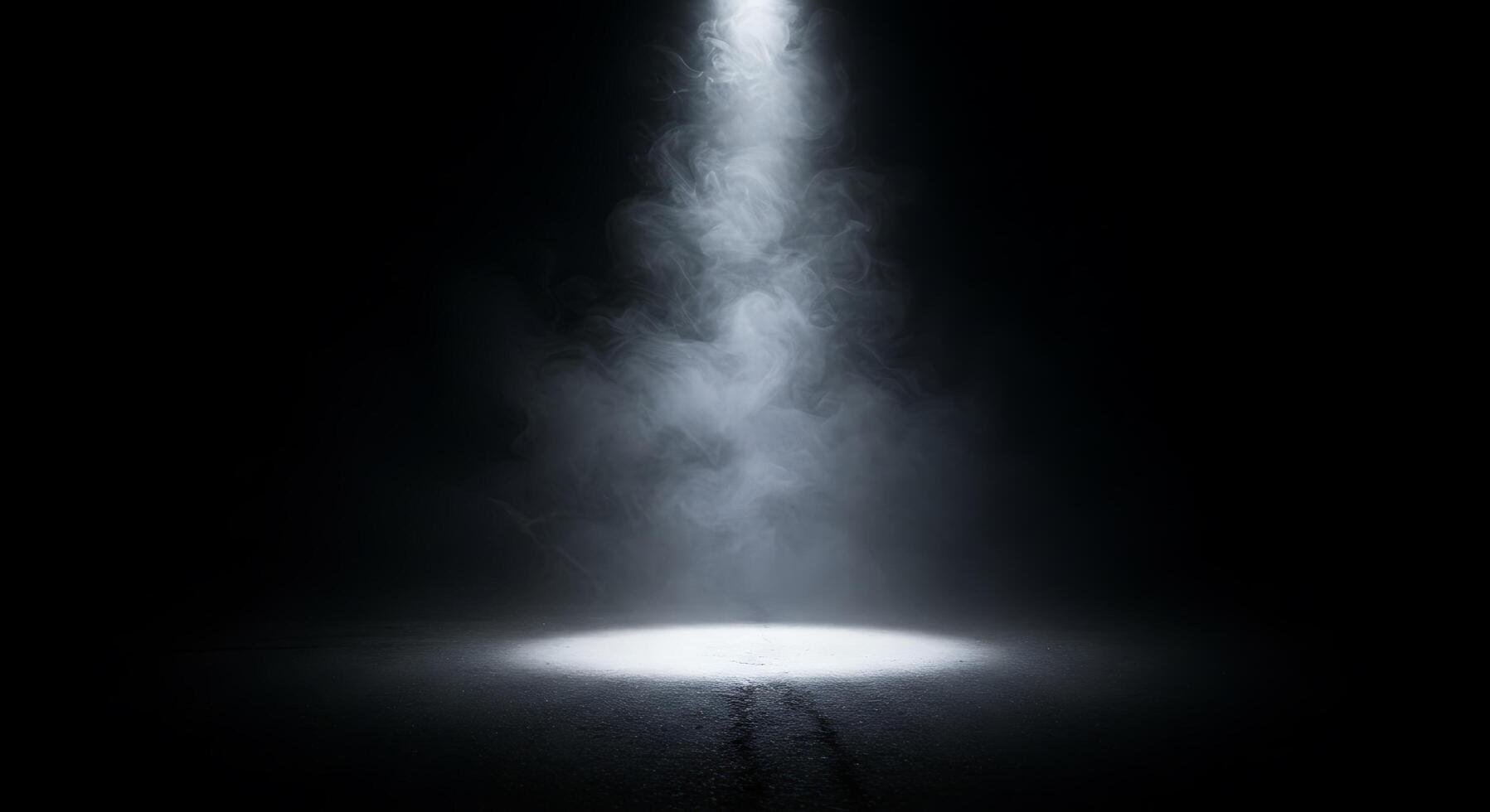 A light shines through the fog in a dark room photo