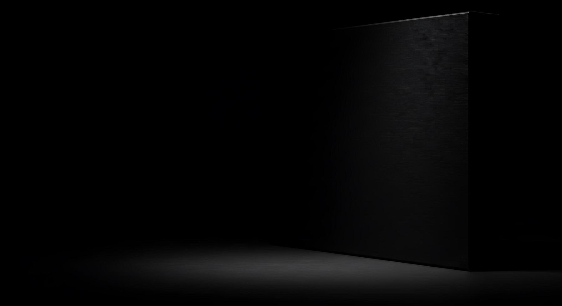 Black box with a light on it in the dark photo
