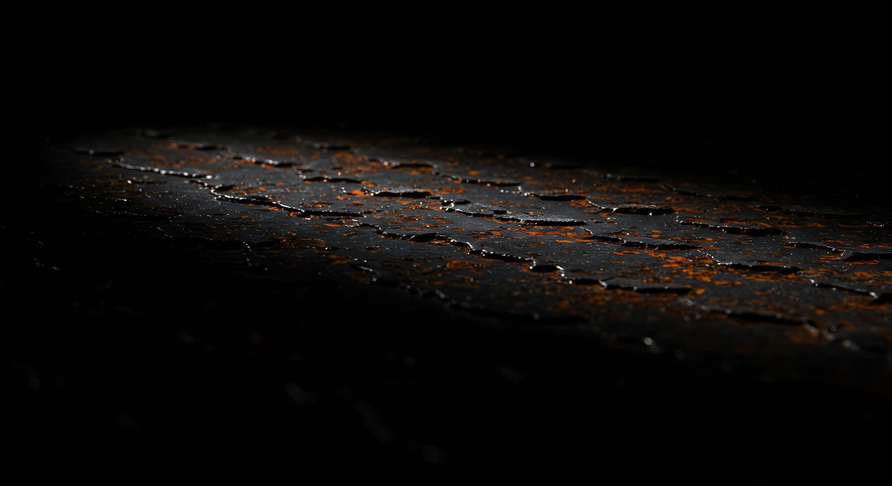 A close up of a black and orange surface photo
