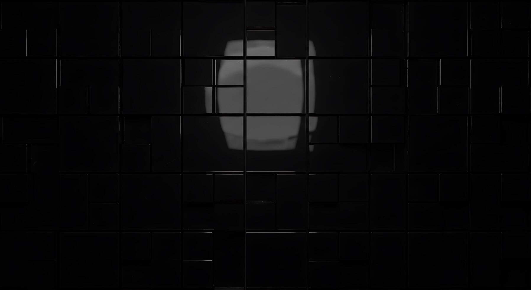 A black wall with a square shape in the middle photo