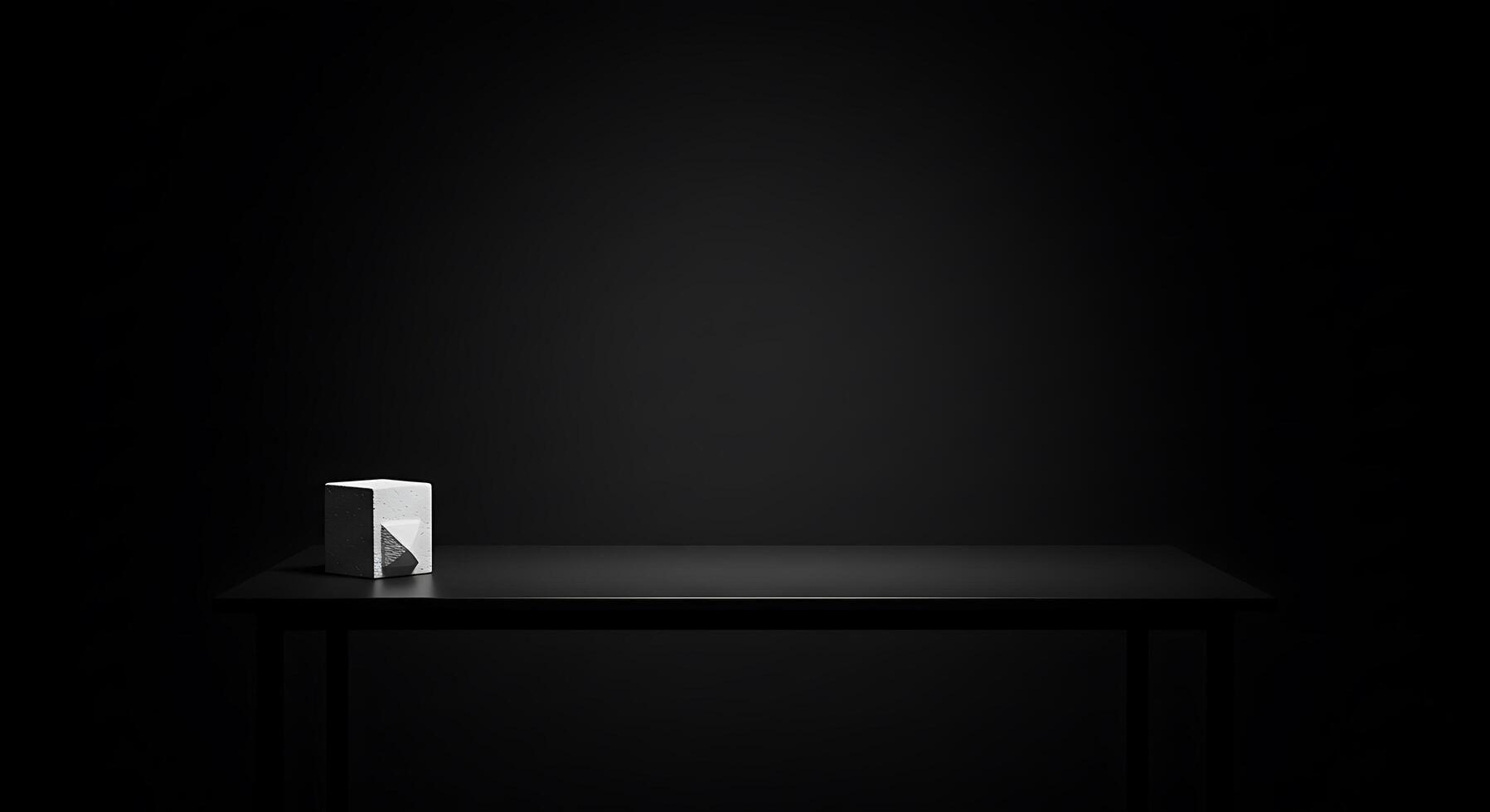 A black table with a white cube on it photo