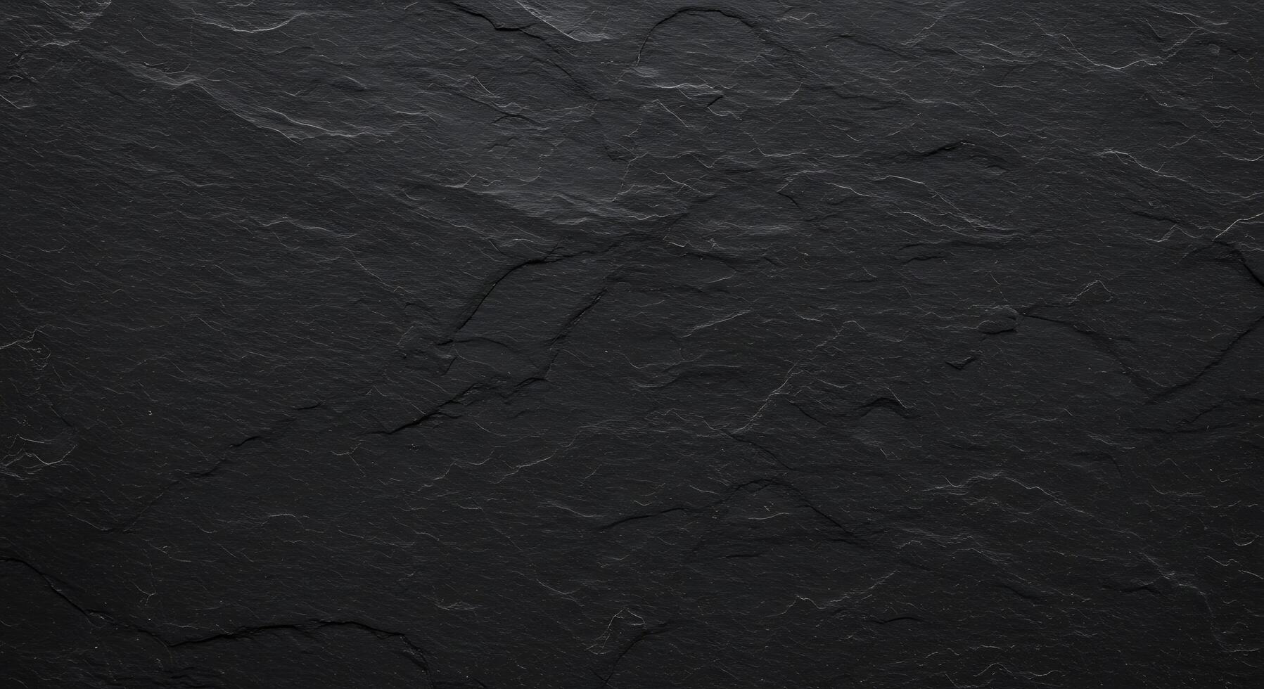 Black stone texture background with cracks photo