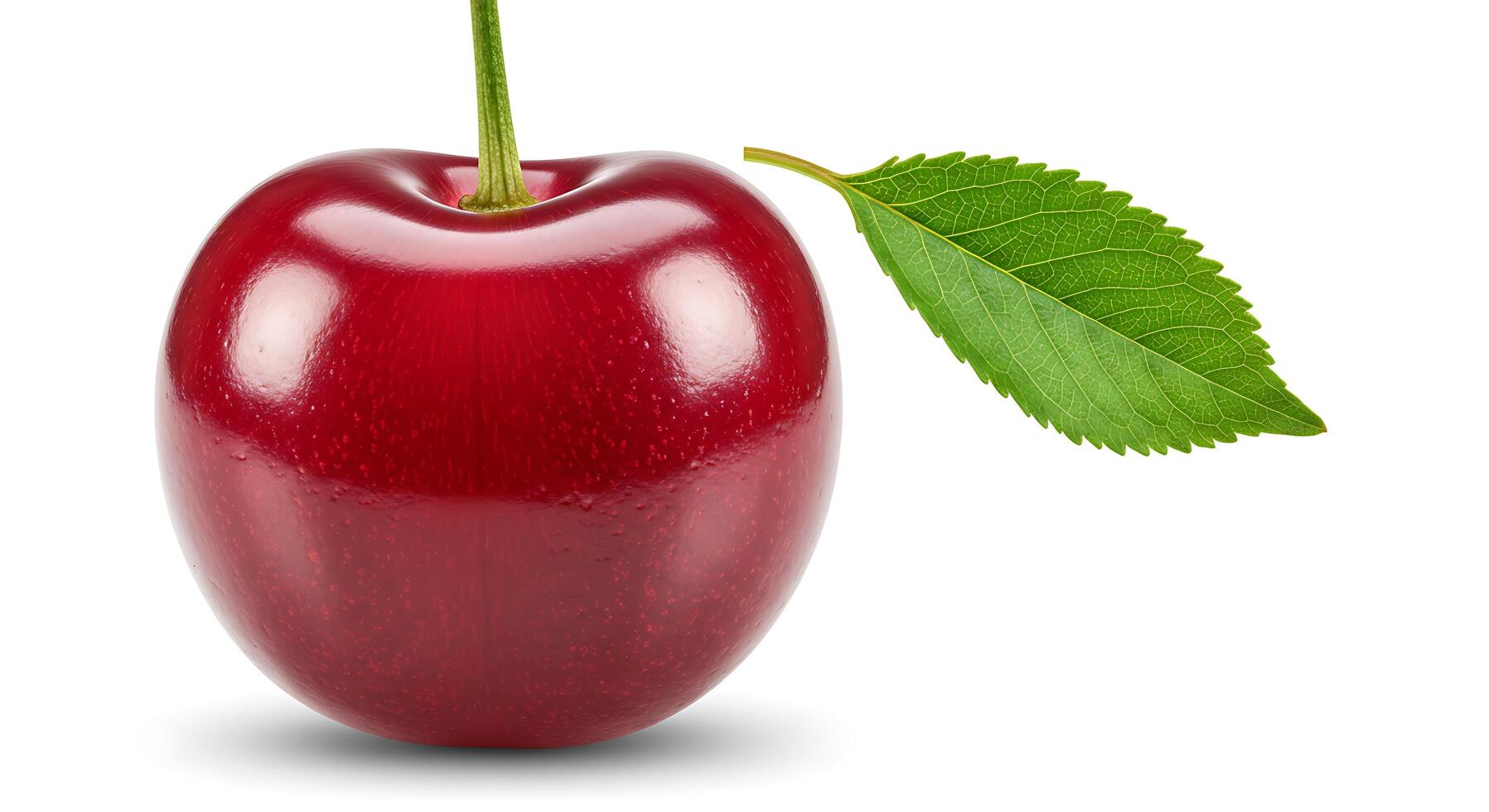 A red cherry with a leaf on it photo