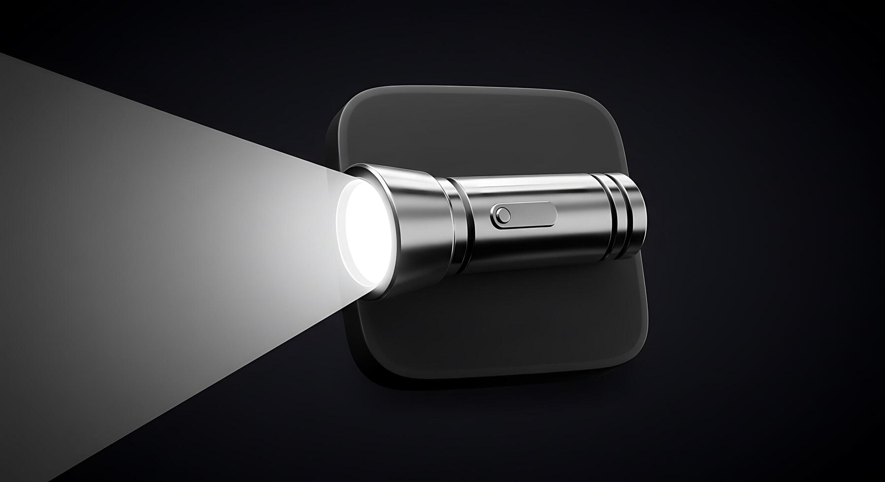 A flashlight is shining on a black surface photo
