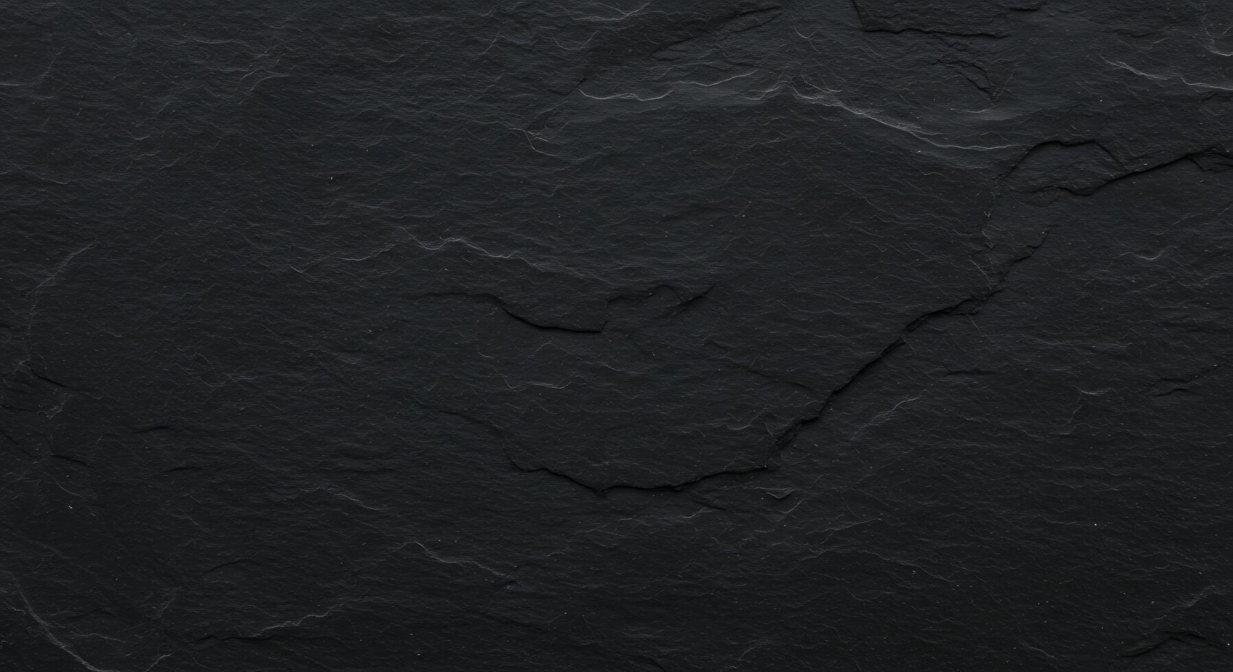 A black slate surface with a dark color photo