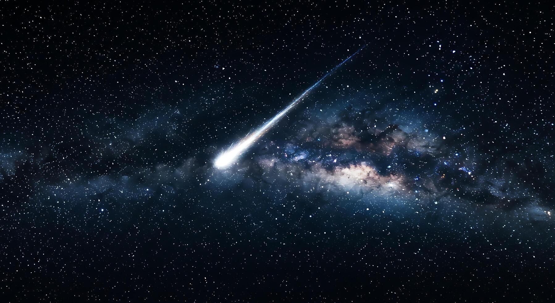 A comet is shooting through the milky way photo