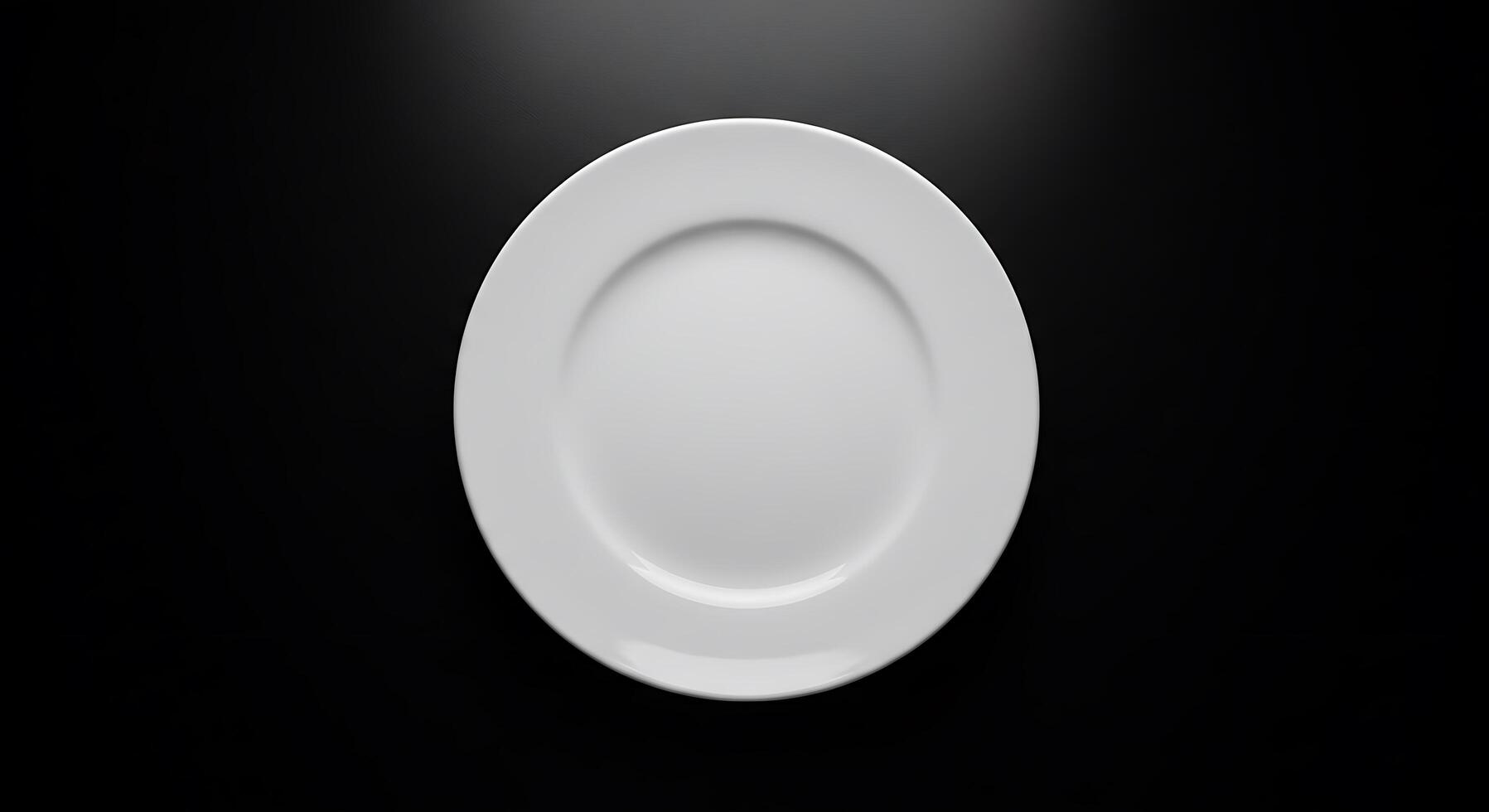 An empty plate on a black background photo