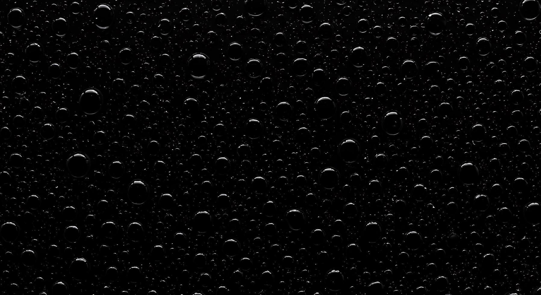 Water drops on a black surface photo