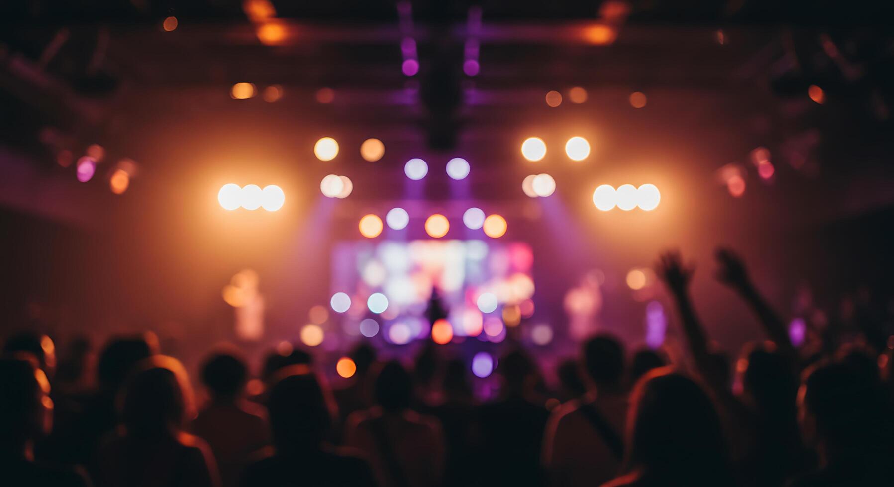 People at a concert with their hands up photo