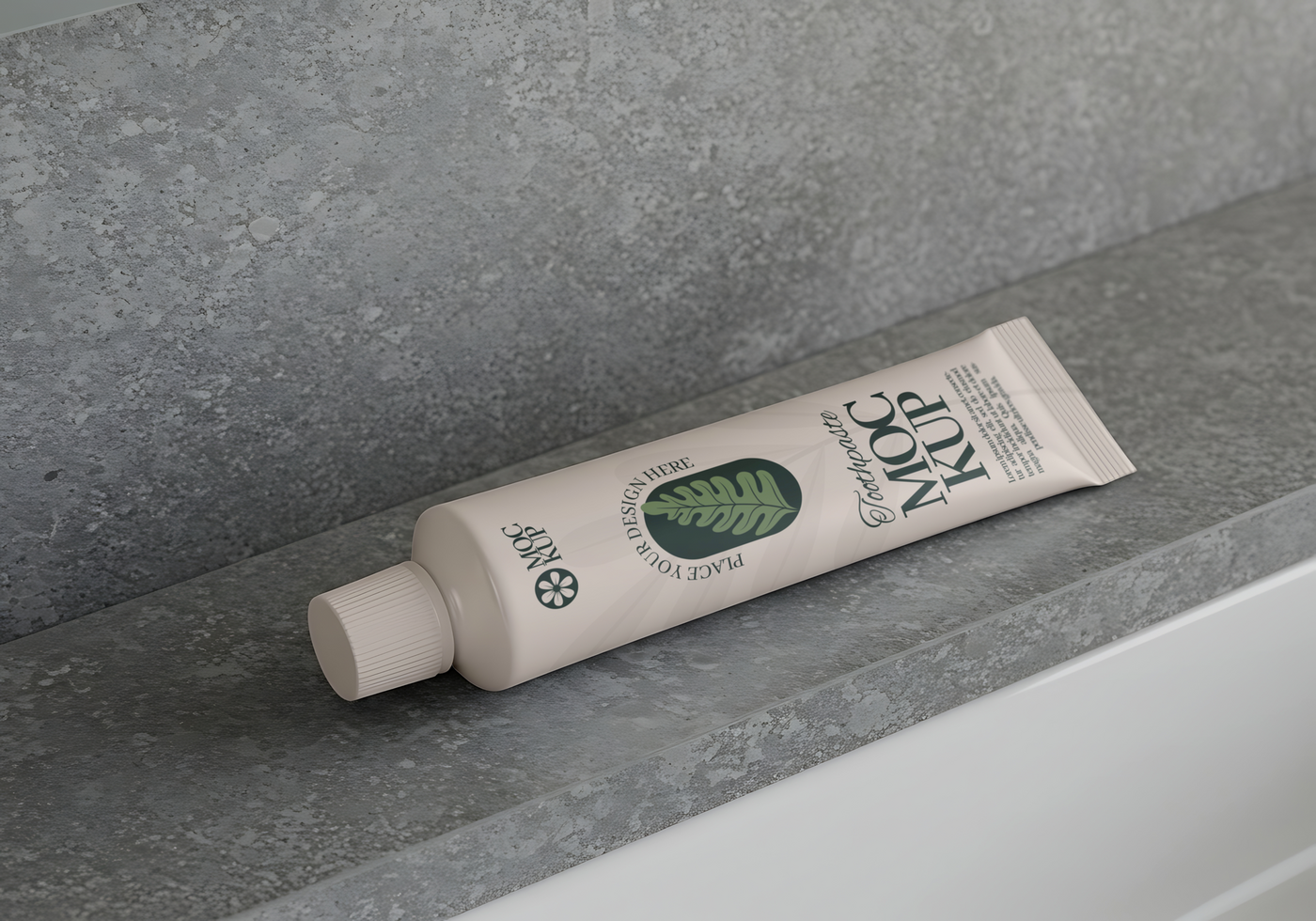 A tube of Moc Kup toothpaste rests on a grey stone surface. psd