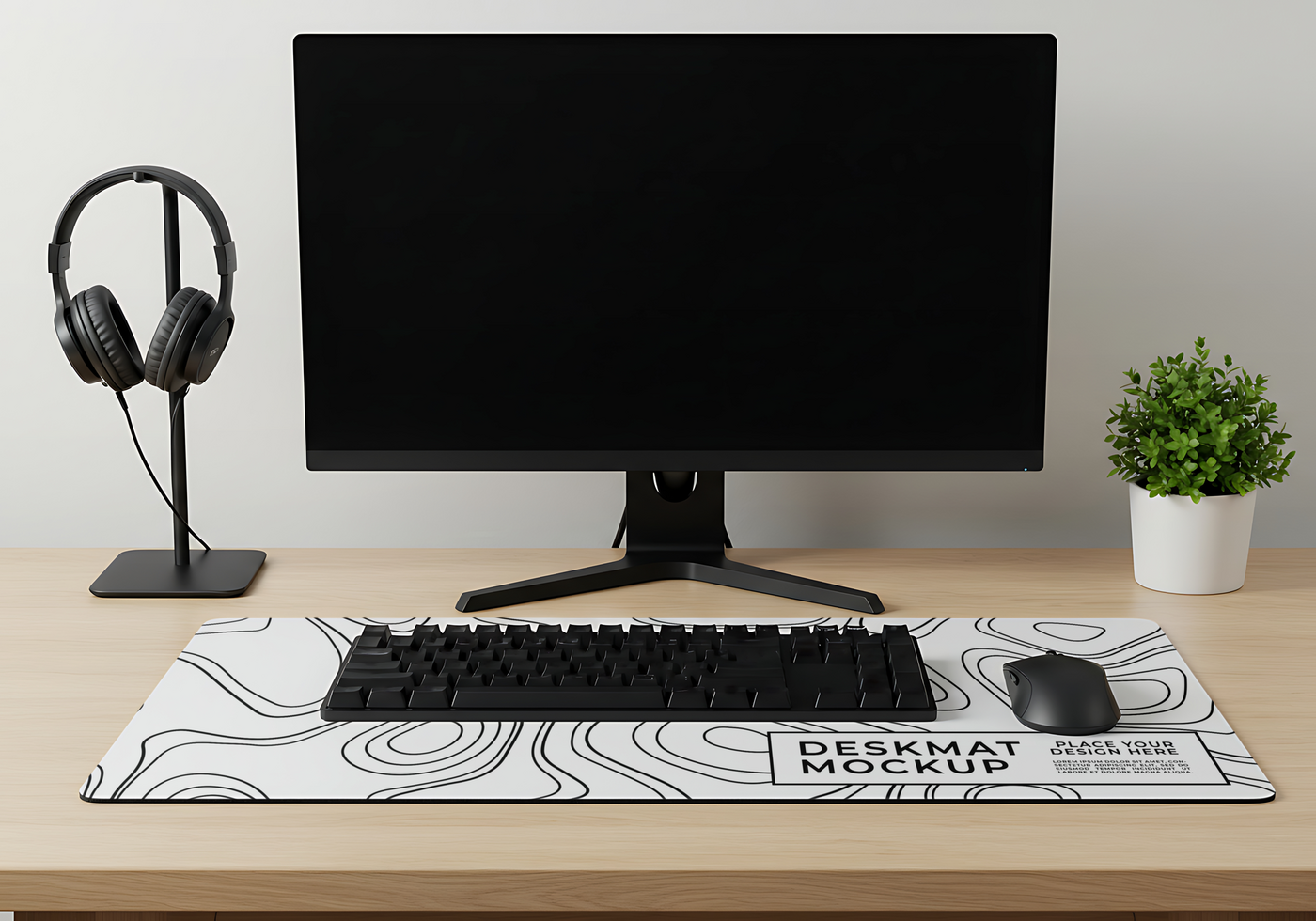 A clean workspace featuring a desktop computer headphones keyboard mouse and a stylish desk mat psd