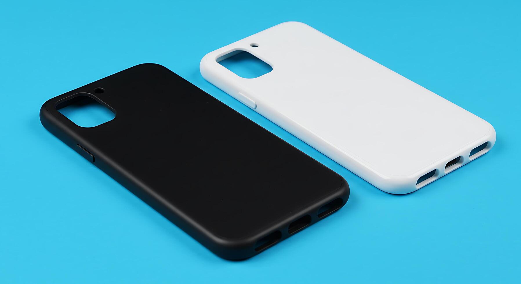 Two white and black cases on a blue surface photo