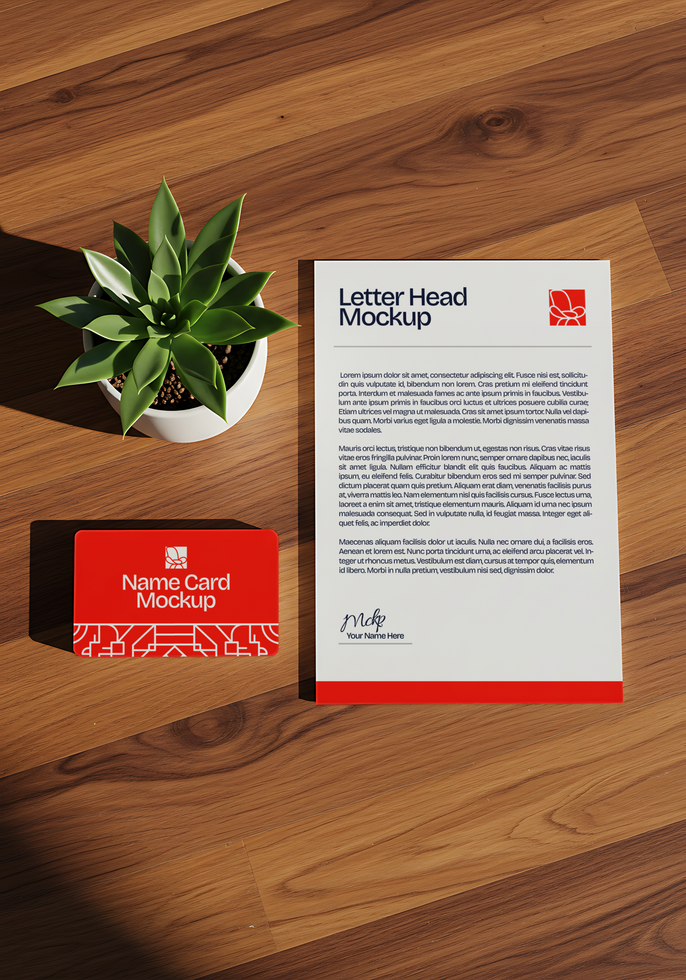A red name card and letterhead mockup rest on a wooden table beside a small succulent psd